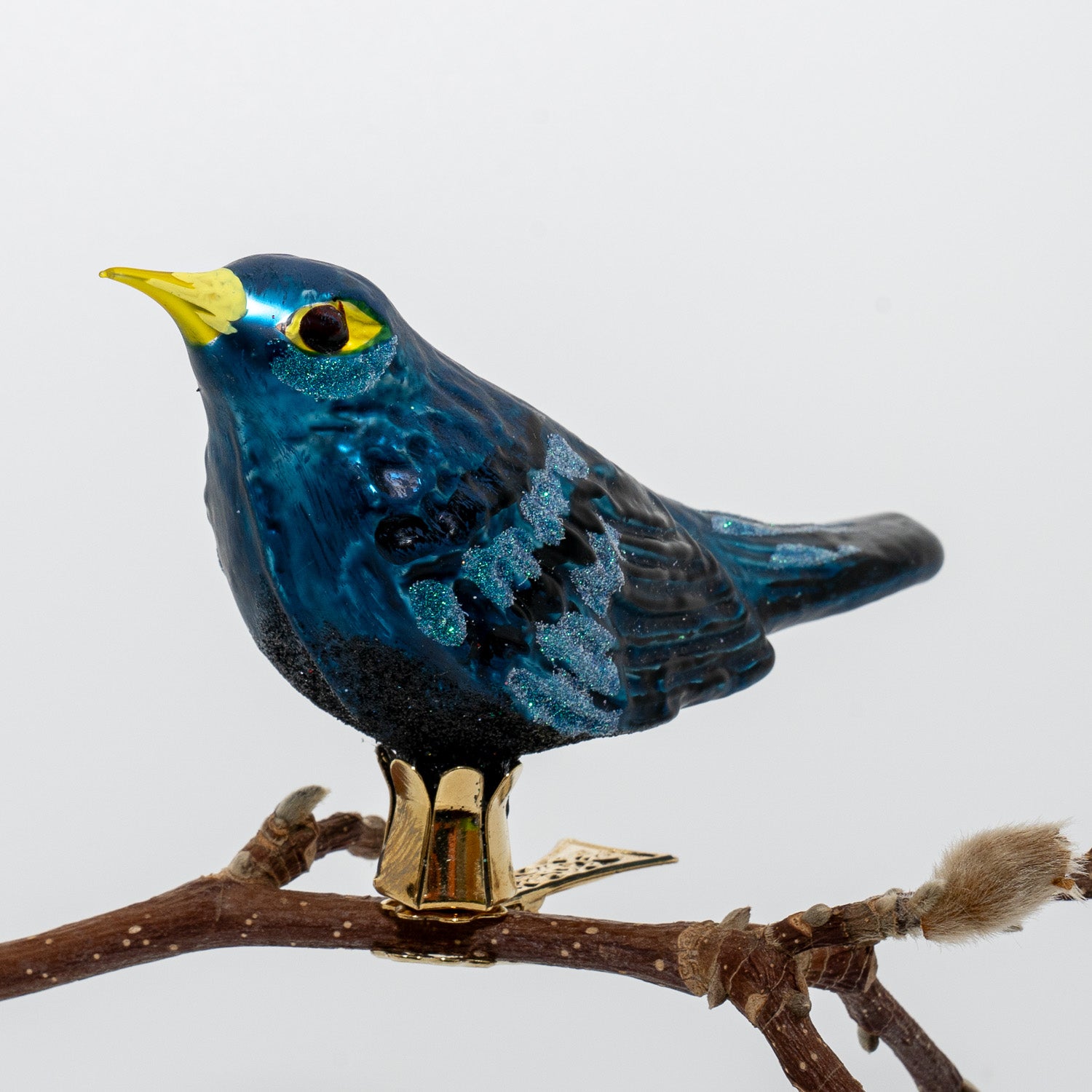 Solsort på klips blå/sort med gult næb