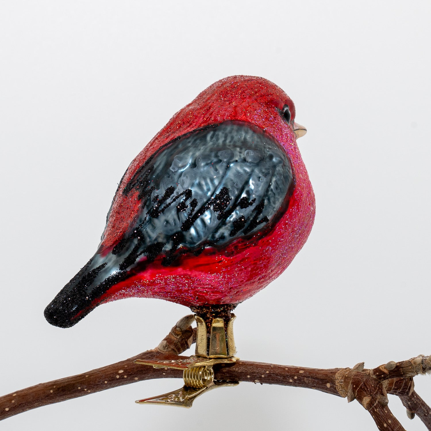 Rød/sort fugl på klips